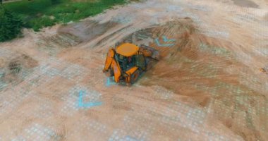 The grader works at the construction site. The concept of a smart grader. A smart construction site. Visualization of smart construction.