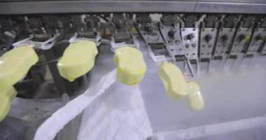 How ice cream is made. The process of making ice cream. Automated ice cream factory.