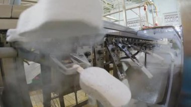 Freezing ice cream on the conveyor. Ice cream production process. Conveyor at the ice cream factory.