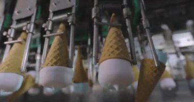 Ice cream on the conveyor line. Ice cream cone on the conveyor. Automated ice cream production line.
