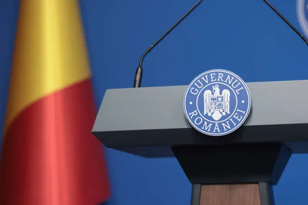 stock image Bucharest, Romania - July 17, 2024: Details with the Romanian Government logo during a press conference held by a minister or politician.