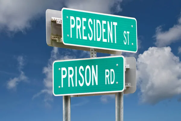 President Street Prison Road Intersection Sign Representing Political Corruption — стокове фото