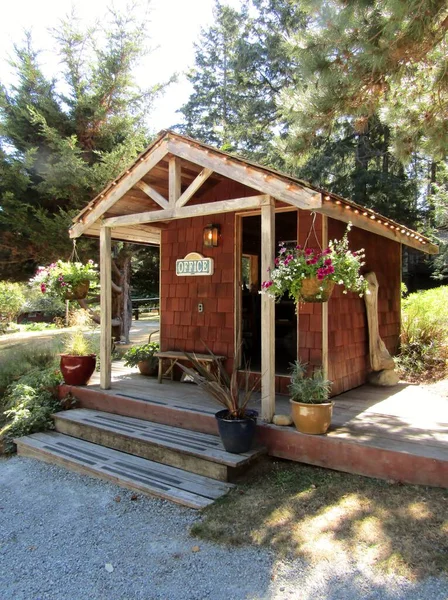Small wooden cabin with Office sing. Galiano Island, BC, Canada