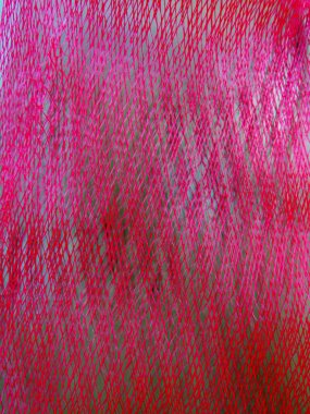 Meyve ve sebze arkaplanı için pembe koruyucu ağ torbası