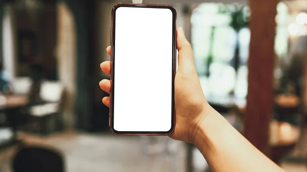 Women\'s hands holding cell telephone blank copy space screen. smartphone with blank white screen isolated. smart phone with technology concept