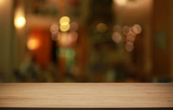 stock image Empty wooden table in front of abstract blurred background of coffee shop . wood table in front can be used for display or montage your products.Mock up for display of produc