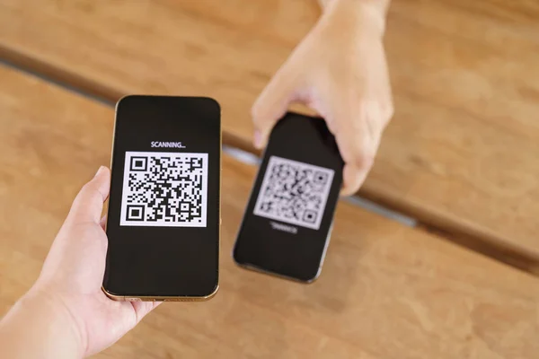 Qr code payment. E wallet. Man scanning tag accepted generate digital pay with out money.scanning QR code online shopping cashless payment and verification technology