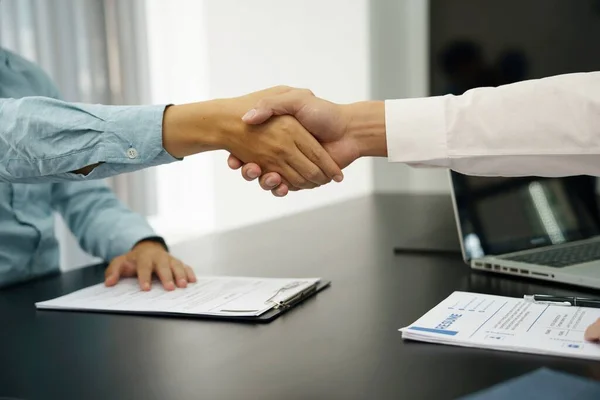 Businessman shaking hands successful candidate at interview. got the job in the team. Welcome aboard successful making a deal