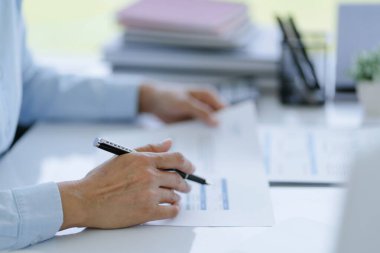 Small business accounting Businesswoman Accountant verify growing business with calculator. Accountancy Concept