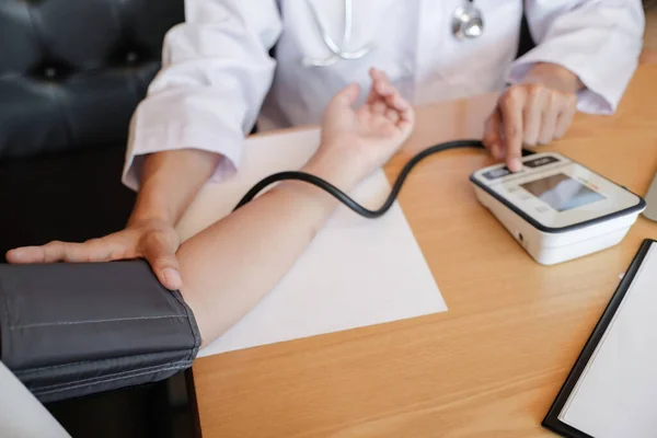 stock image Doctor checking  patient arterial blood pressure. Health care.