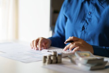 Small business accounting Businesswoman Accountant verify growing business with calculator. Accountancy Concept