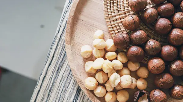 stock image Organic Macadamia nut. macadamia nuts are cracked and baked to taste extremely delicious superfood fresh natural shelled macadamia and healthy food concept