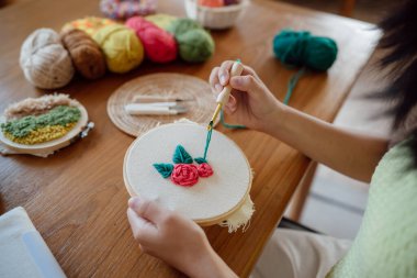 Punch needle. Asian Woman making handmade Hobby knitting in studio workshop. designer workplace Handmade craft project DIY embroidery concept