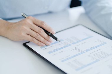 Small business accounting Businesswoman Accountant verify growing business with calculator. Accountancy Concept