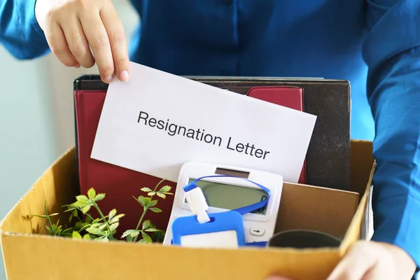 Quit Job Business man sending resignation letter and packing Stuff Resign Depress or carrying business cardboard box in office. Change of job or fired from company