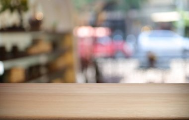 Boş ahşap masa üstü ve arka plan bulanıklığı metin pazarlama promosyonu için boş ahşap masa alanı. boş tahta tablo kopyalama alanı arkaplanı