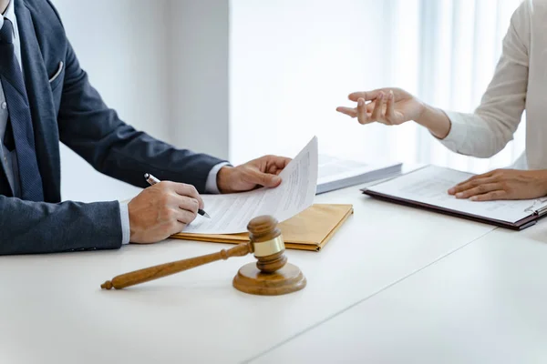 stock image Lawyer Legal counsel presents to the client a signed contract with gavel and legal law. justice and lawyer Business partnership meeting