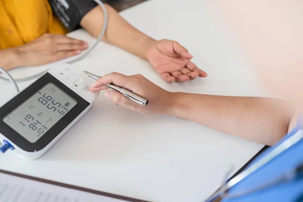 Stock image Doctor checking  patient arterial blood pressure. Health care