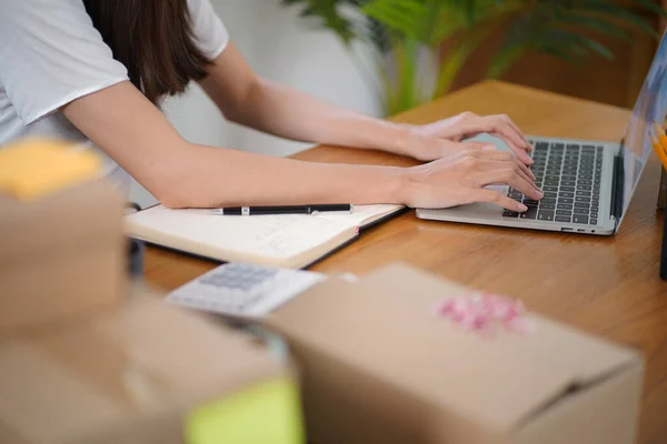 stock image Business From Home Asian woman preparing package delivery box Shipping for shopping online. young start up small business owner at home online order.