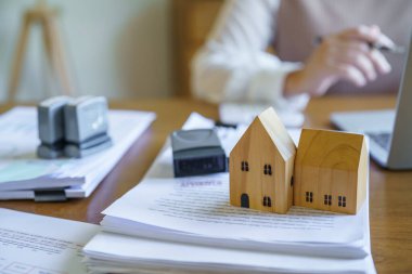 Approved stamp with Business people signing contract making deal with real estate consultant home insuranc