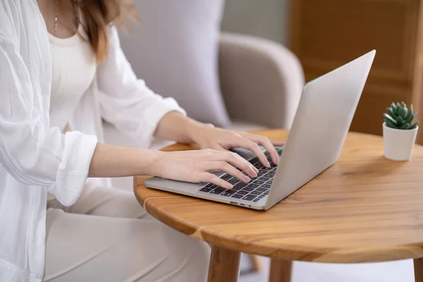 stock image Business woman working from home. work online on laptop. Asian businesswoman working on sofa online business with social distancing laptop online meeting