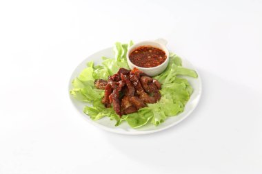 Instant noodles, seafood salad, and vegetables in a white dish.