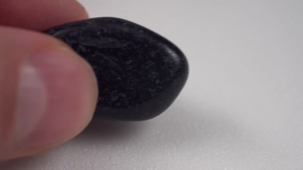 Close Natural Mineral Geological Collection Tumbled Black Onyx Gem Stone — Stockvideo