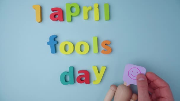 April Fools Day Concept Blue Background Flat Lay — Stock Video