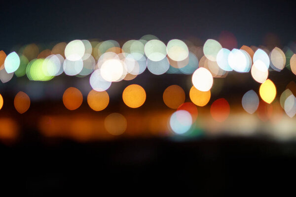 Big city lights defocus bokeh. Blurred night neon.