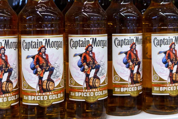 stock image Tyumen, Russia-March 17, 2023: Captain Morgan original spiced gold spirit drink bottles. Sale of alcohol in the supermarket