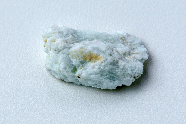 Albite crystal mineral, white background close up. Lepidolite
