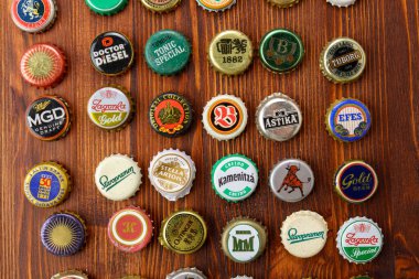 Tyumen, Russia-February 15, 2023: Set of beer caps. A mix of various beer bottle caps