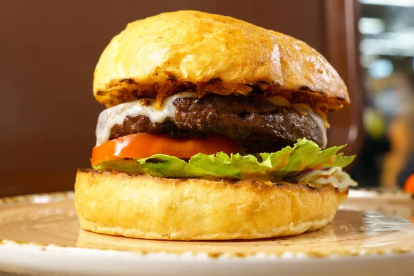 Juicy burger with beef patty close-up. Selective focus