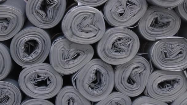 Gray Plastic Rolls Stacked Disorderly Manner Creating Sound Roller Paper — Stock Video