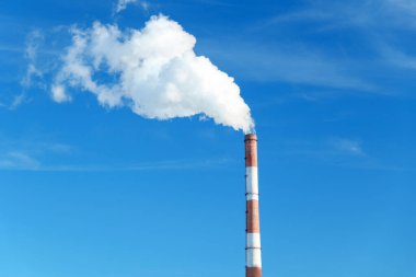 Smokestack emits thick creating a striking visual image of industrial pollution. clipart