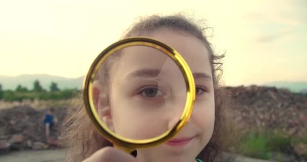 Happy Little Smiling Girl Looking Camera Magnifying Glass Children Dream — Stock Video