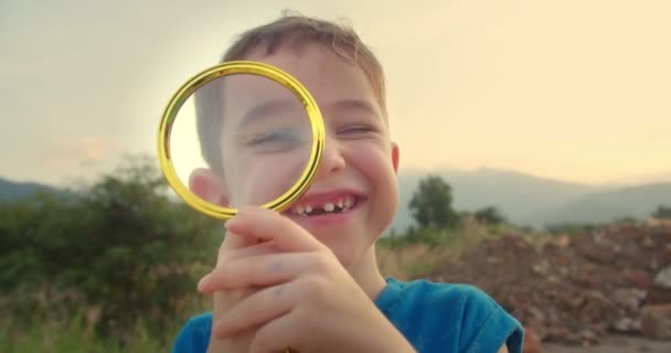 Happy Little Smiling Girl Looking Camera Magnifying Glass Children Dream — Stock Video