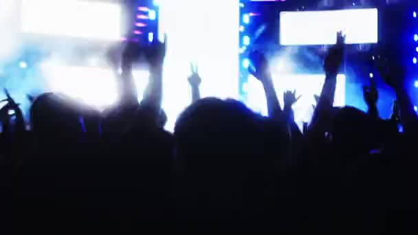 Silhouettes Fans Raise Hands Front Bright Colorful Strobe Lights Stage — Stock Video