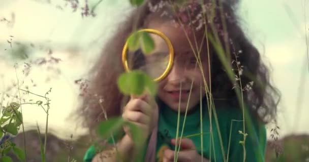 Happy Little Smiling Girl Looks Magnifying Glass Nature Child Dreams — Stock Video