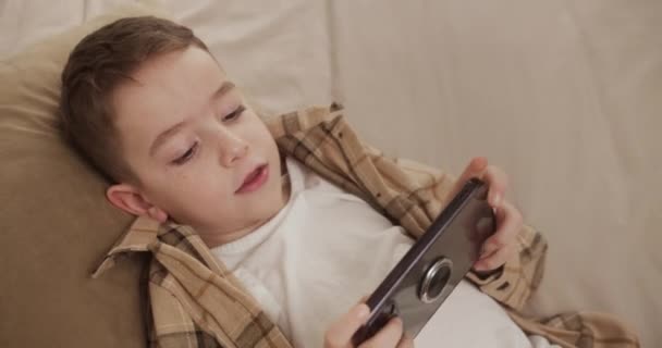 Beautiful Child Boy Years Old Playing Mobile Game Smartphone Home — Stock Video