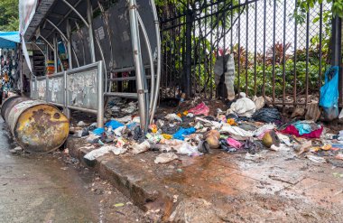 MUMBAI - SEPTEMBER 24: Piles of garbage and dirty waste in a street of Mumbai on September 24. 2022 in India