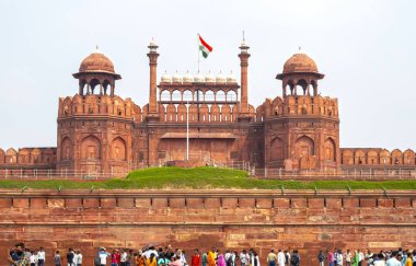 NEW DELHI - SEPT 17: Facade of The Red Fort or Lal Qila and visitors in New Delhi on September 17. 2022 in India clipart