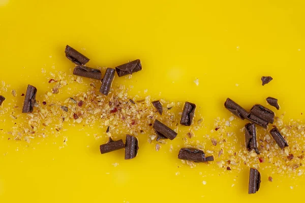 Surface of yellow fruit cake with chocolate pieces as background