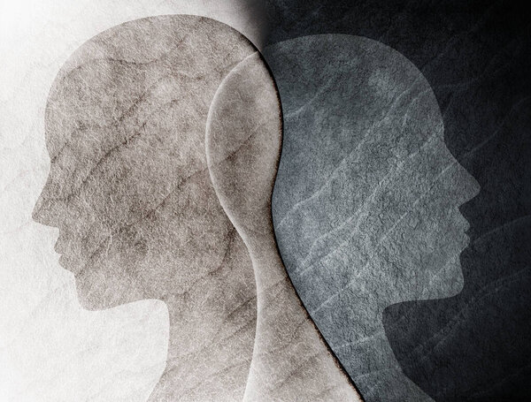 Биполярное расстройство психическое понятие. Смена настроения. Эмоции. Разделение личности. Двойная личность. Силуэт головы человека на черно-белом фоне