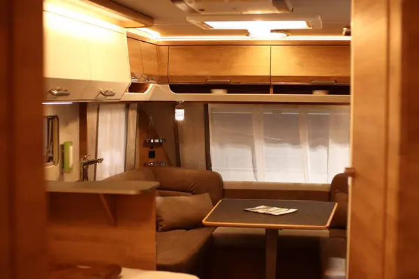 Interior design of a living room in a motorhome on wheels. Caravan, camper. Mobile home. Furniture