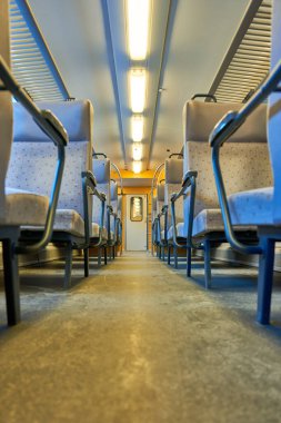 Inside a Swiss Train: Modern Seats, Spacious Aisle, and Interior View of a Passenger Carriage  Luxury Travel Experience in Switzerland clipart