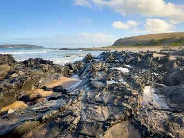 Landscape views of rocks and ocean from beaches along the Victor Harbor Heritage Trail on the Fleurieu Peninsula in South Australia clipart