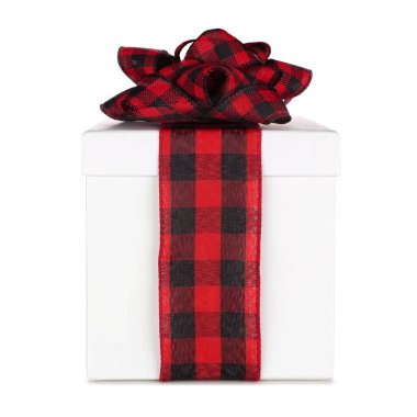 White Christmas gift box with black and red buffalo plaid bow and ribbon. Side view isolated on a white background.