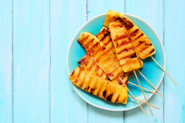 Sweet Grilled Summer Pineapple Wedges Overhead View Soft Blue Wood — Stock Photo, Image
