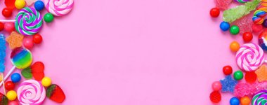 Tatlı şeker koleksiyonu. Pembe afiş arkaplan üzerinde üstten aşağı çift kenarlık.